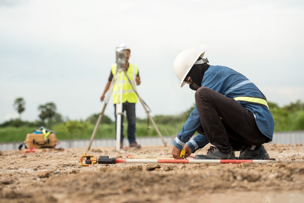 land-surveyors-collecting-data-from-construction-site